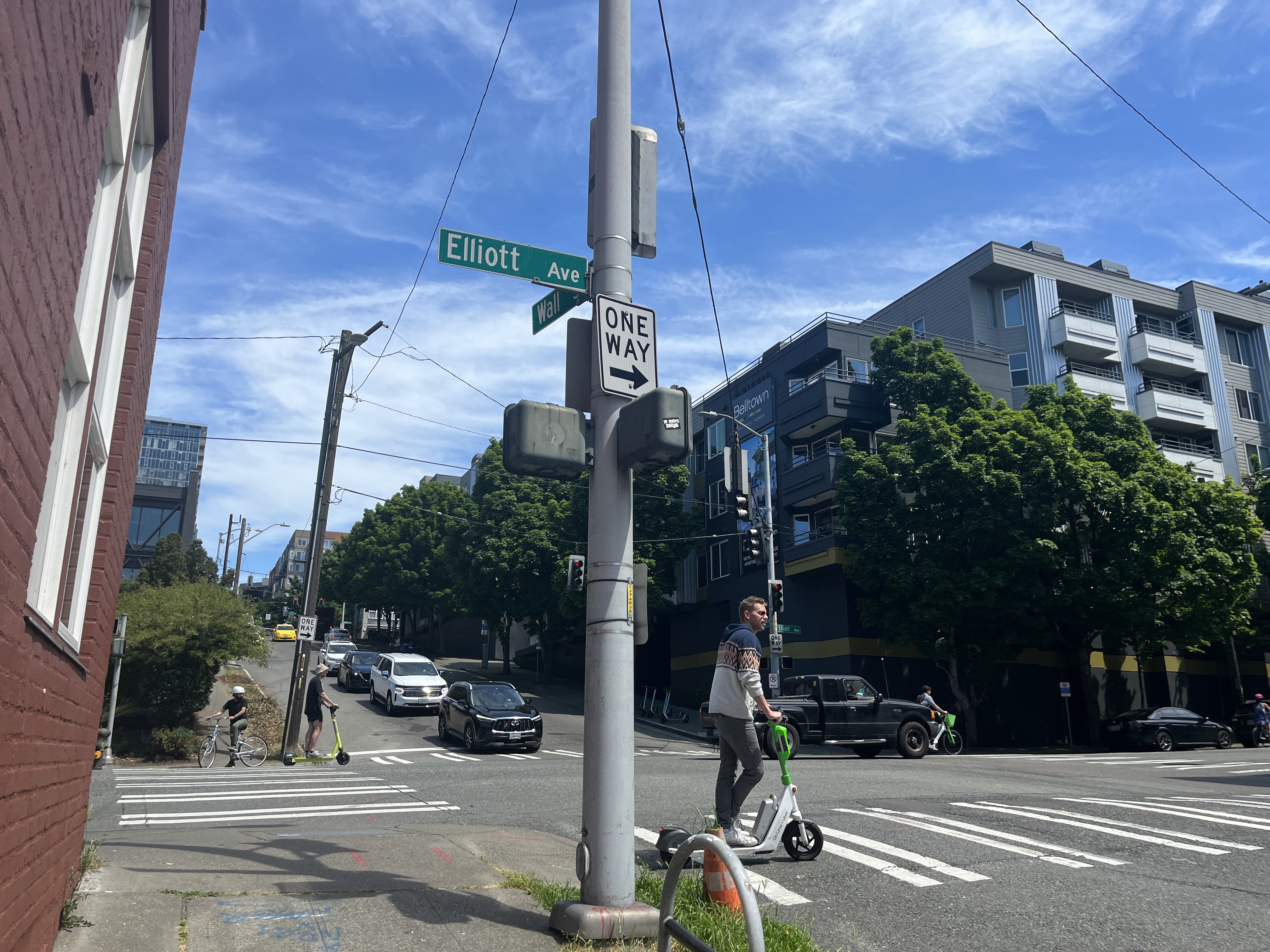 Crew cruising on scooters near Elliot Ave and Wall St